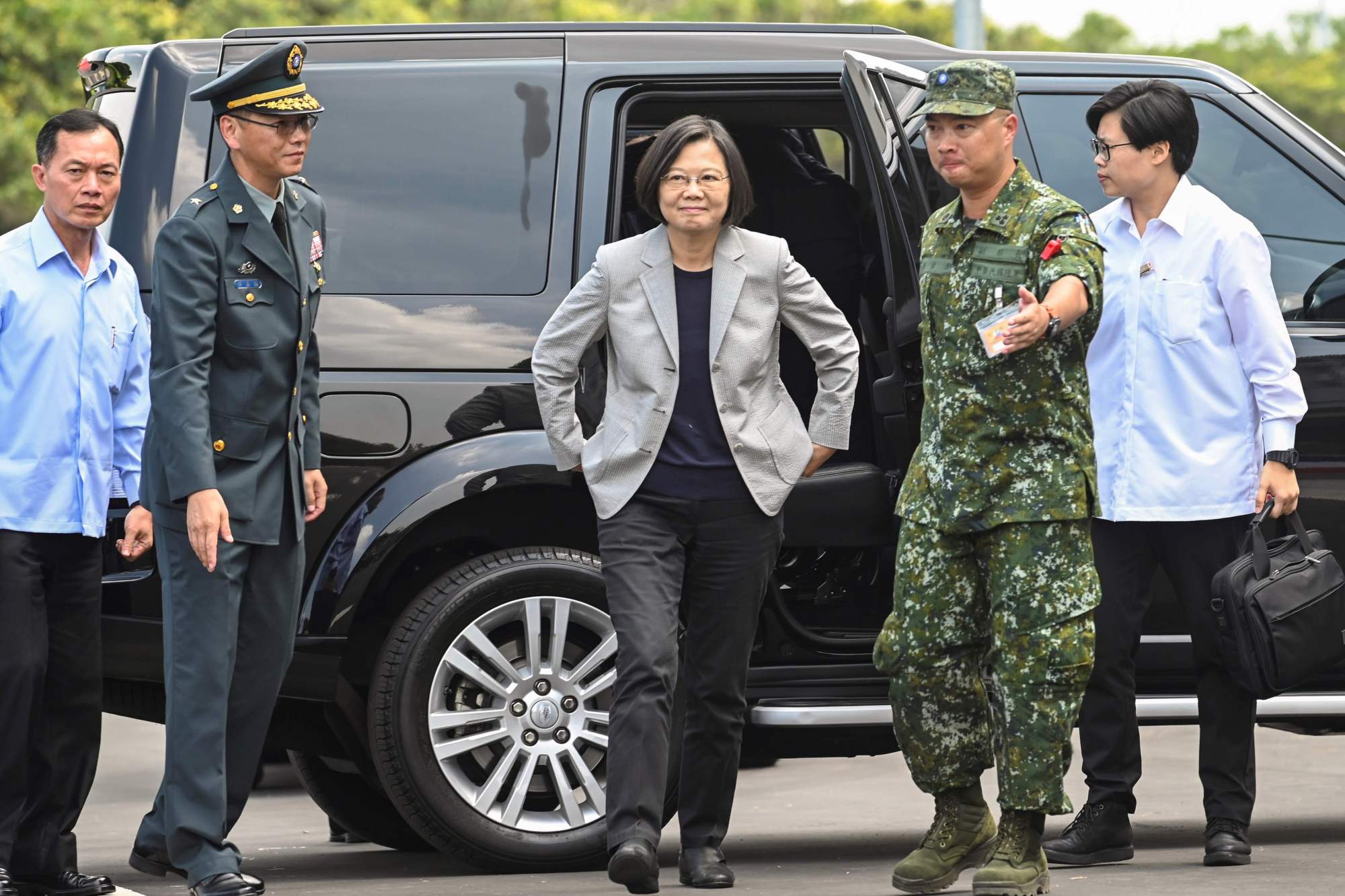 Taiwanese President Tsai Ing-wen arrives at a military base in Hsinchu, northern Taiwan, on Tuesday. | AFP-JIJI