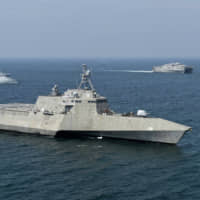 The USS Montgomery littoral combat ship, expeditionary fast transport ship USNS Millinocket and Royal Malaysian Navy Kasturi-class corvette Gagah Samudera sail together with other participating ships during a joint exercise in the Strait of Malacca on Aug. 16. | U.S. NAVY