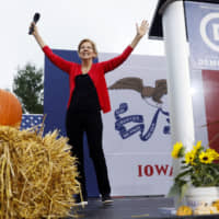 U.S. Democratic presidential candidate Sen. Elizabeth Warren speaks at the Polk County Democrats Steak Fry on Saturday in Des Moines, Iowa. | AP