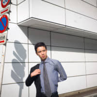 Eridanus Yano, a young FX trader, poses in Tokyo on Sept. 5. | BLOOMBERG