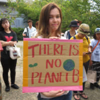 People rally in Kyoto on Friday as part of the global climate strike. | ERIC JOHNSTON