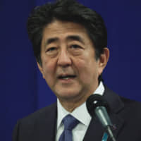 Prime Minister Shinzo Abe addresses the media in Biarritz, France, on Aug. 26. | AFP-JIJI