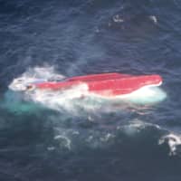 The Keiei Maru No. 65 is seen Tuesday after it capsized 600 km east of Nemuro, Hokkaido. | JAPAN COAST GUARD / VIA KYODO