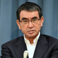 New Defense Minister Taro Kono speaks during a group interview Wednesday at his ministry in Tokyo. | SATOKO KAWASAKI