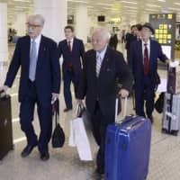 Hideki Miyazaki (left), a former Upper House member of the ruling Liberal Democratic Party, and senior officials from the Japan Medical Association arrive in Pyongyang on Saturday. | KYODO