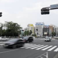The crosswalk in front of JR Yotsuya Station in Chiyoda Ward, Tokyo, is shown on Aug. 18 after a Metropolitan Police Department patrol car hit and seriously injured a then-4-year-old boy the same day. | KYODO