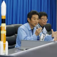 Atsutoshi Tamura, a Mitsubishi Heavy Industries Ltd. official in charge of Wednesday\'s rocket launch, gives details of a fire that broke out near the launch pad at the Tanegashima Space Center, in Kagoshima Prefecture, during a news conference the same day. | KYODO