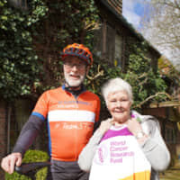 Patrick McIntosh poses in this undated photo with veteran English actress Dame Judi Dench, who has supported his work with cancer charities. | COURTESY OF KMG FOUNDATION