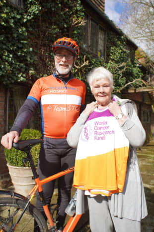 Patrick McIntosh poses in this undated photo with veteran English actress Dame Judi Dench, who has supported his work with cancer charities. | COURTESY OF KMG FOUNDATION