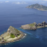 Some of the Senkaku Islands, controlled by Japan but also claimed by China, are seen in September 2012. Japan plans to set up a new police unit with jurisdiction over the islands, public broadcaster NHK reported Monday, in a move that could step up pressure in a flash point with China. | KYODO