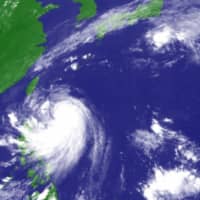Typhoon Mitag, the season\'s 18th typhoon, is seen Sunday in this satellite image. | JMA