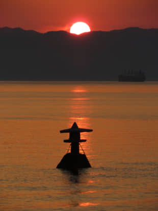 Stone on the water: A stone lantern appears to float of Shiraishi Island in the Seto Inland Sea during half-tide at sunset. | AMY CHAVEZ