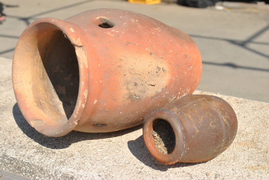 Gone to pots: Two ceramic 'tako tsubo' pots that were used to catch octopuses now serve as nostalgic decorations at the local seafood restaurant on Shiraishi Island. | AMY CHAVEZ