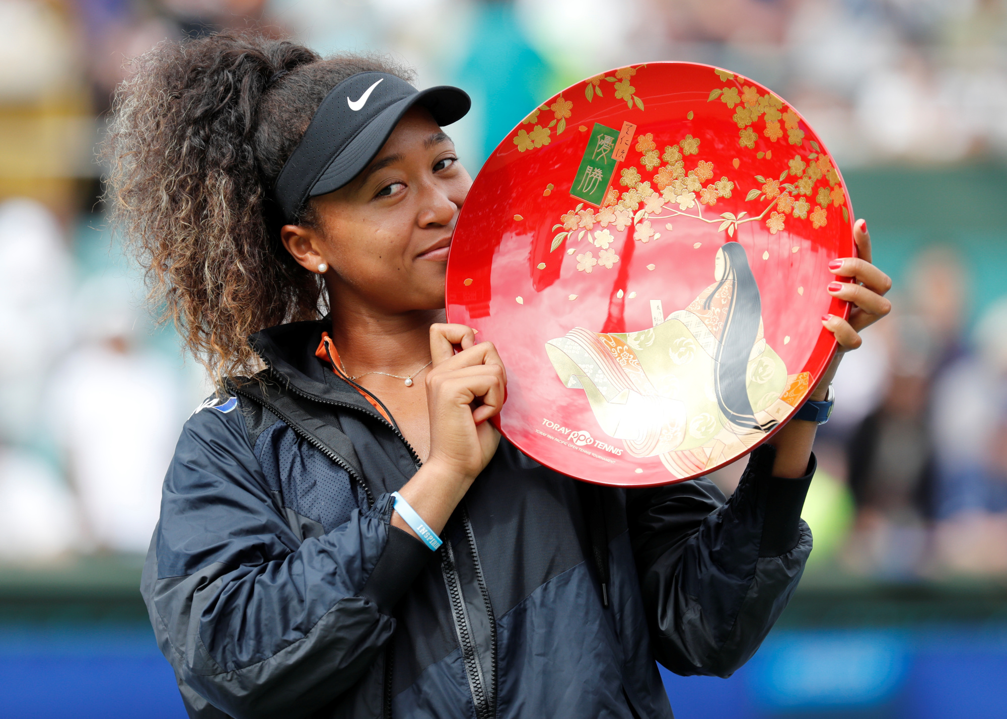 Better things to do: While A Masso performed a comedy set in which they suggested Naomi Osaka 'bleach' her skin, the tennis champion was busy winning the Pan Pacific Open in Osaka. | REUTERS