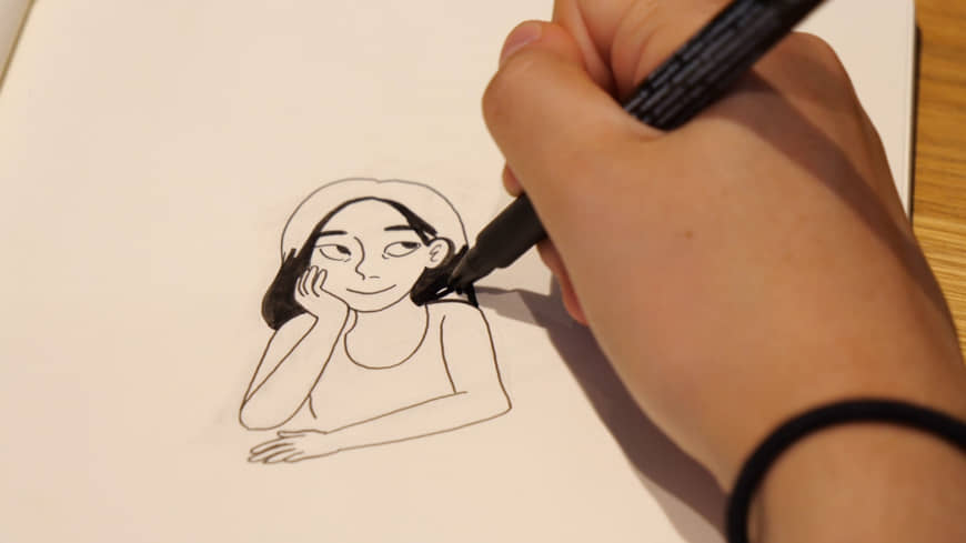 This is me: Christine Mari Inzer sketches a self-portrait at the offices of The Japan Times. | CHISATO TANAKA