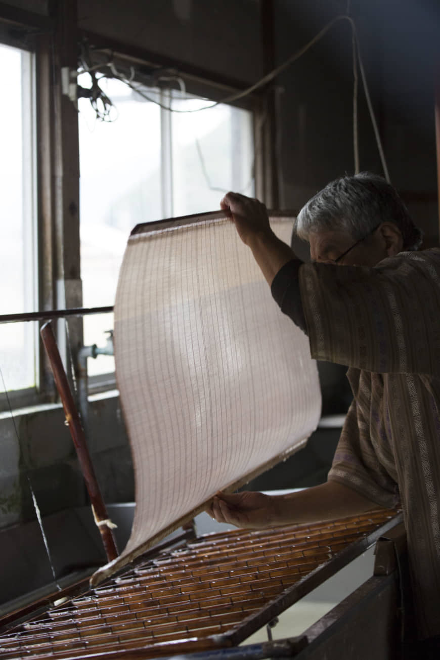Good things take time: When a sheet is complete, water is drained from the paper and it is left to stand overnight, then dried in the sun. | MASASHI KUMA