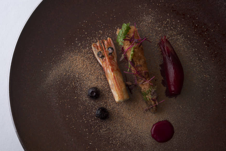 From tip to tail: Dried sakura-ebi shrimp atop a barely cooked shrimp tail and blueberry pickles | COURTESY OF COOK JAPAN PROJECT