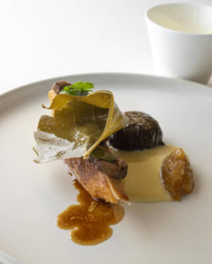 That's a wrap: Guinea fowl layered with slices of liver and heart and wrapped in a pickled grape leaf | COURTESY OF COOK JAPAN PROJECT