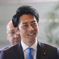 Fresh face: Newly appointed Environment Minister Shinjiro Koizumi arrives at the prime minister\'s official residence in Tokyo on Sept. 11.  AP | AP