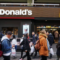 Keeping it simple: McDonald\'s is setting the same prices for eating in and eating out that incorporate the upcoming tax increase. | BLOOMBERG