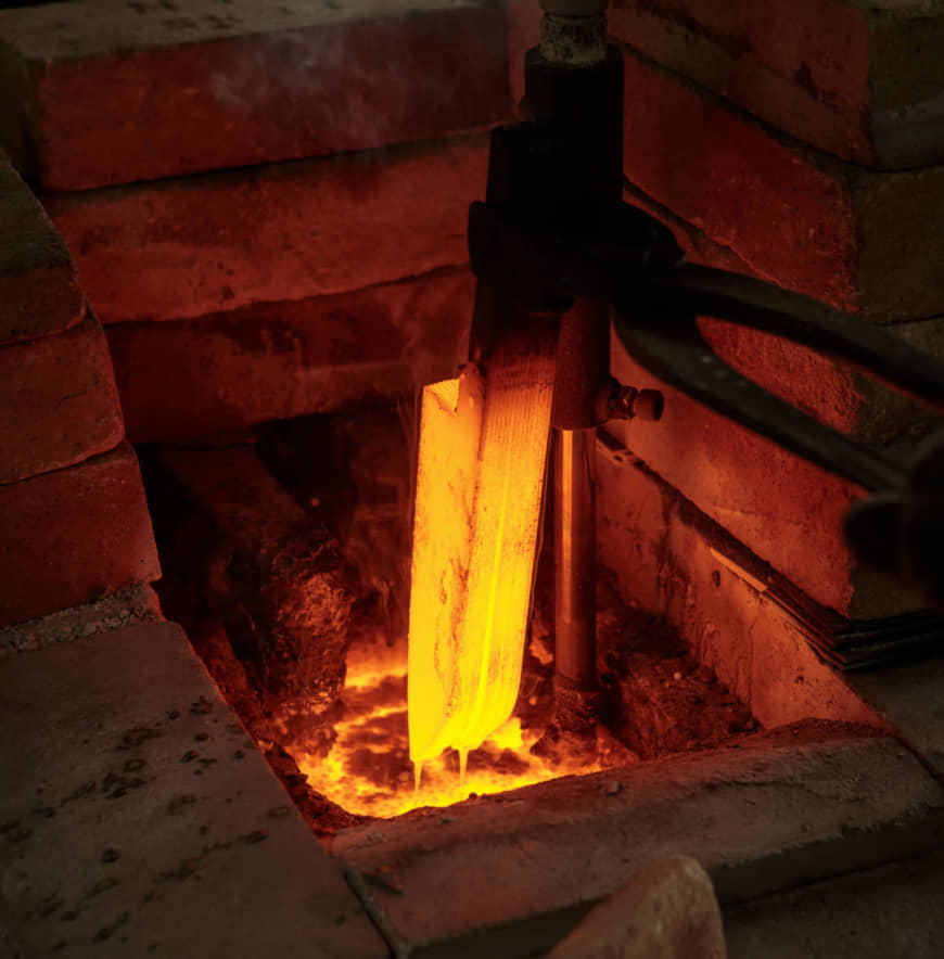 Salt soak: Judging the correct temperature is even trickier when forging stainless steel than it is for traditional steel. Here a stainless steel blade emerges after 10 minutes in a 1,050-degree Celsius salt bath.