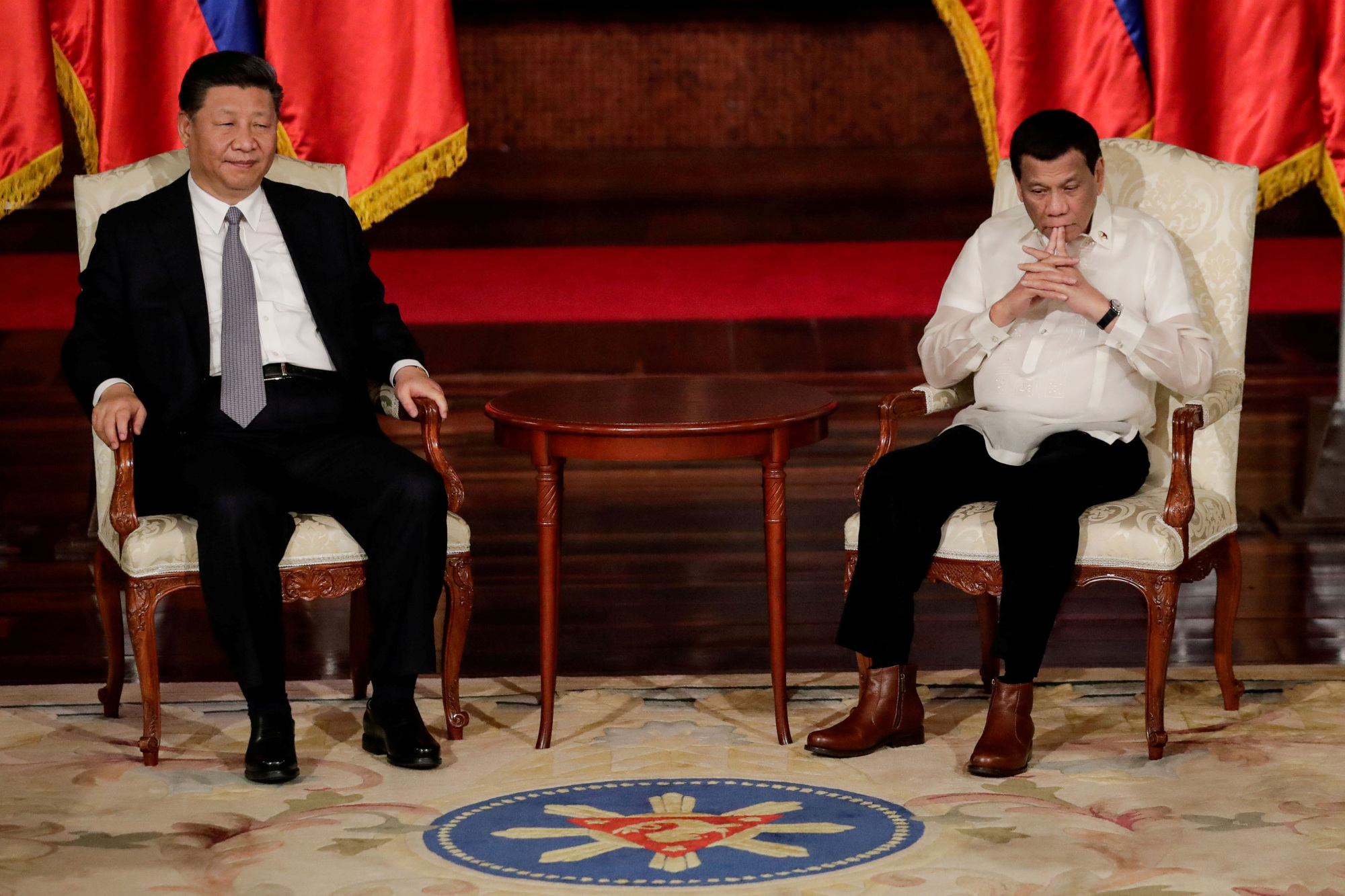 Since taking power in 2016, Philippine President Rodrigo Duterte, seen here meeting with Chinese President Xi Jinping in Manila last November, has chosen mostly to accommodate rather than resist Beijing's pressure. | REUTERS