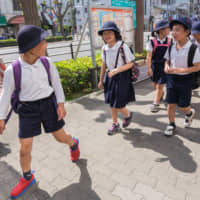 Japanese school children are taught to value conformity from an early age. | GETTY IMAGES