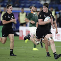 New Zealand\'s Scott Barrett scores a try against South Africa in a Rugby World Cup Pool B game at International Stadium Yokohama on Saturday. The All Blacks defeated the Springboks 23-13. | AP