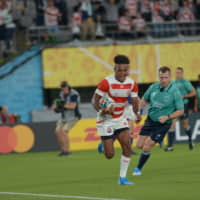 The Brave Blossoms\' Kotaro Matsushima scores one of his three tries on Friday against Russia. | DAN ORLOWITZ