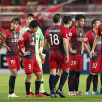 Antlers players react after being knocked out of the Asian Champions League on Wednesday in Kashima, Ibaraki Prefecture. | KYODO