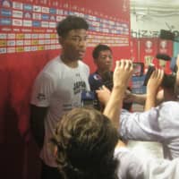 Rui Hachimura speaks to reporters after Monday\'s practice. | KAZ NAGATSUKA
