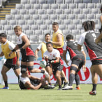 The Japan national team practices at Tokyo Stadium on Thursday morning, a day before its Rugby World Cup opener against Russia. | KYODO