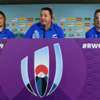 All Blacks coach Steve Hansen speaks between players Brad Weber (right) and Jack Goodhue at a news conference at International Stadium Yokohama on Friday afternoon ahead of Saturday\'s showdown with South Africa. | REUTERS