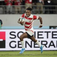 Japan\'s Kotaro Matsushima runs to score his third try of the game against Russia during the Rugby World Cup Pool A game at Tokyo Stadium on Friday night. | AP