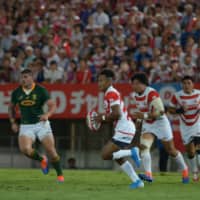 The Brave Blossoms\' Kotaro Matsushima carries the ball against the Springboks in the first half on Friday night. | DAN ORLOWITZ