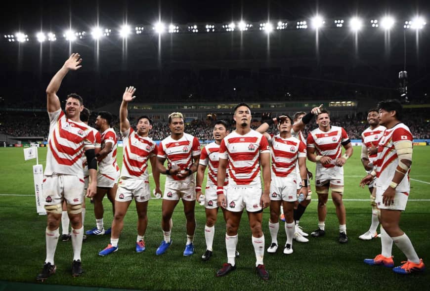 Japan’s players wave to the crowd after their upset win over Ireland. | AFP-JIJI