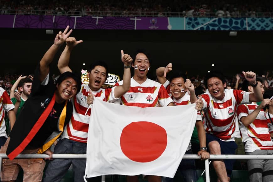 Japan supporters celebrate after the Brave Blossoms defeat Ireland. | AFP-JIJI