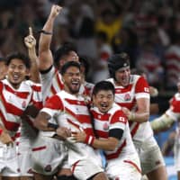 Japan\'s Brave Blossoms celebrate Saturday after beating Ireland in the second Pool A game of the 2019 Rugby World Cup. | REUTERS