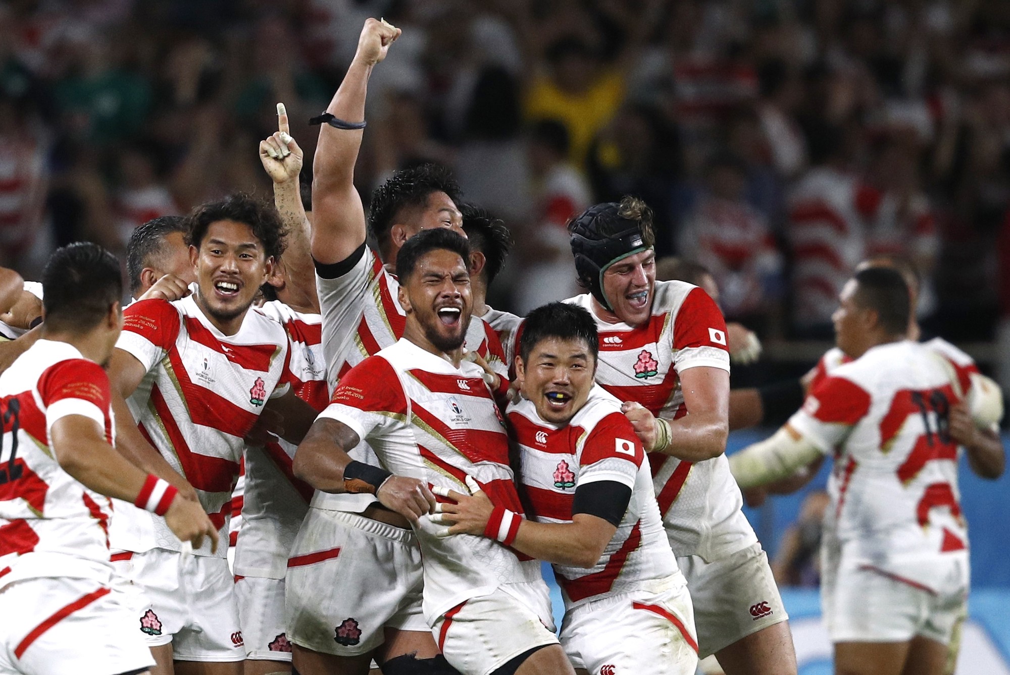 Japan's Brave Blossoms celebrate Saturday after beating Ireland in the second Pool A game of the 2019 Rugby World Cup. | REUTERS