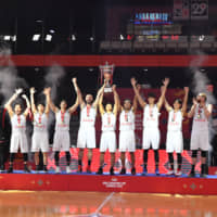 The Alvark Tokyo celebrate their victory over Al Riyadi in the FIBA Asia Champions Cup final on Sunday in Bangkok. | ALVARK TOKYO
