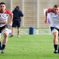 England flankers Tom Curry (left) and Sam Underhill participate in a training session in Sapporo on Thursday. | AFP-JIJI