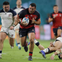 England\'s Ellis Genge runs with the ball against the United States in a Rugby World Cup Pool C game at Kobe Misaki Stadium on Thursday night. England won 45-7. | AP