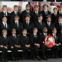 The Brave Blossoms don Rugby World Cup caps on Friday during a ceremony in Tokyo. | KYODO