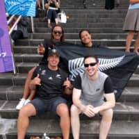 New Zealand fans (back, from left) Angela Johnson, Kahureremoa Hoko and (front left) Richard Johnson and Ireland fan Patrick McHugh get in the mood before Saturday\'s Rugby World Cup game in Yokohama. | ANDREW MCKIRDY