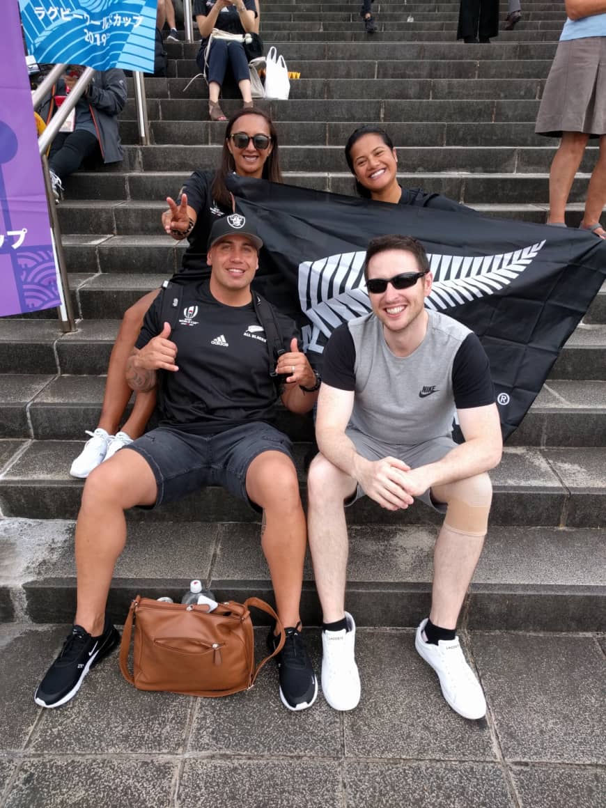New Zealand fans (back, from left) Angela Johnson, Kahureremoa Hoko and (front left) Richard Johnson and Ireland fan Patrick McHugh get in the mood before Saturday's Rugby World Cup game in Yokohama. | ANDREW MCKIRDY