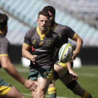 Bernard Foley passes the ball as the Australia national team trains on Sept. 6 in Sydney. | AP