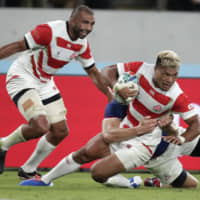 New Zealand-born Michael Leitch (left) and Lomano Lemeki are two of 16 foreign-born players representing Japan at the 2019 Rugby World Cup. | AP