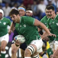 Ireland\'s Iain Henderson runs the ball against Scotland at International Stadium Yokohama on Sunday. | REUTERS