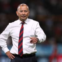 England coach Eddie Jones stands on the field before his team\'s game against Tonga during the Rugby World Cup on Sunday in Sapporo. | REUTERS