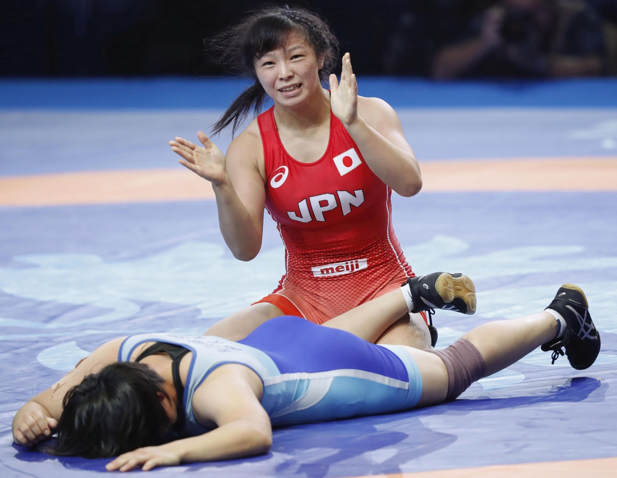 Yukako Kawai defeats North Korea's Rim Jong Sim in the women's 62-kg division bronze-medal match at the World Wrestling Championships on Friday in Nur-Sultan, Kazakhstan. | KYODO